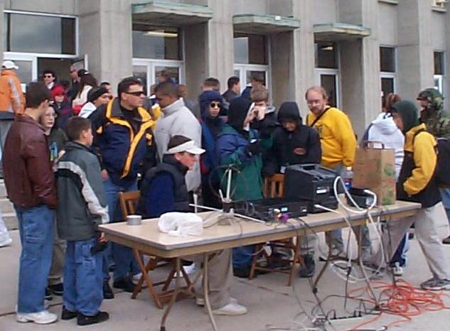 Students watch live TV from the weather 
 balloon